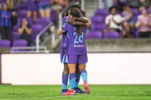 Image of Barbra Banda and Summer Yates celebrating a goal against Utah.