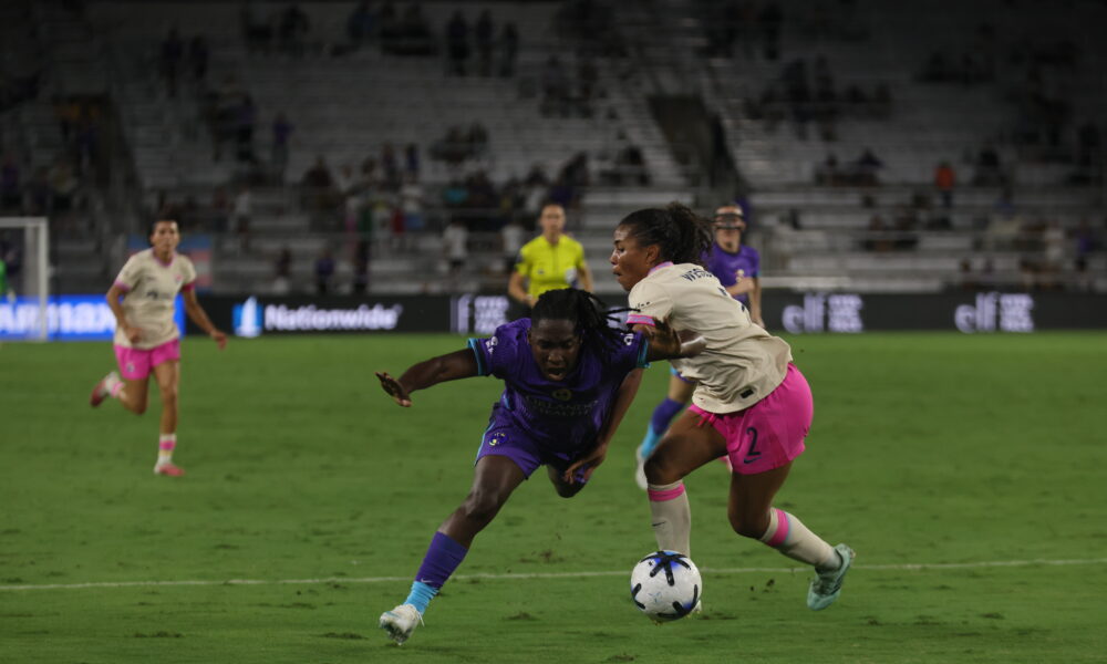 Image of Barbra Banda being fouled against San Diego.