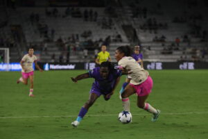 Image of Barbra Banda being fouled against San Diego.