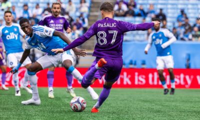 Image of Marco Pasalic trying to fire a shot through traffic against Charlotte.