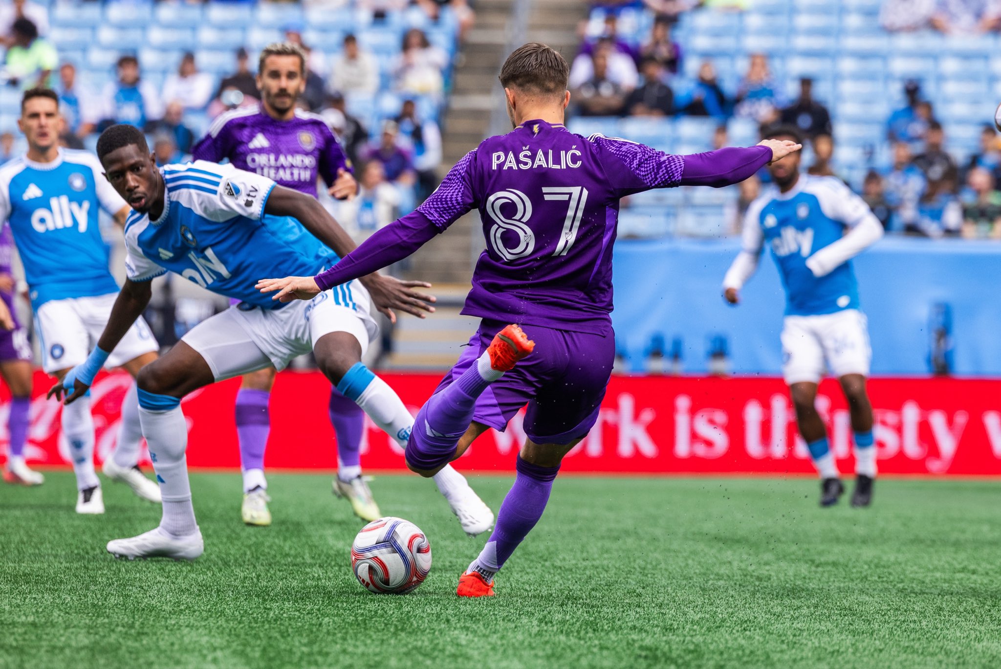 Image of Marco Pasalic trying to fire a shot through traffic against Charlotte.