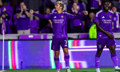 Image of Antoine Griezmann celebrating with fans and Daryl Dike.