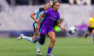 Image of Solai Washington running onto a ball behind the Gotham defense.