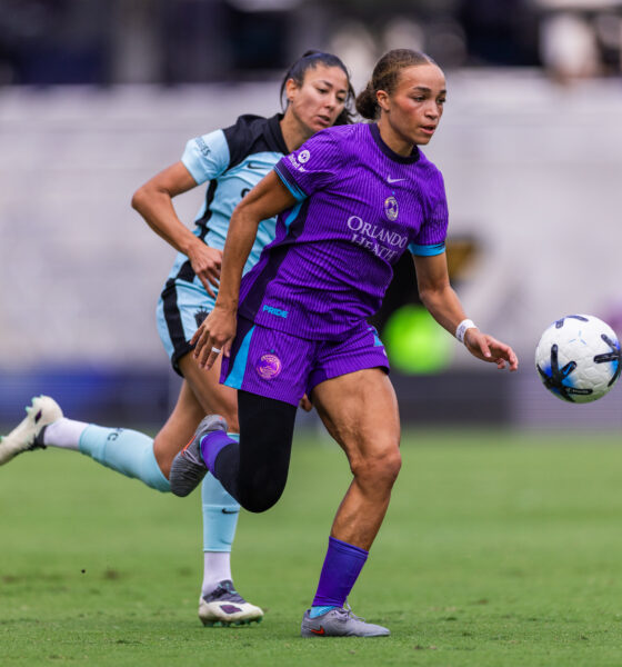 Image of Solai Washington running onto a ball behind the Gotham defense.