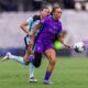 Image of Solai Washington running onto a ball behind the Gotham defense.