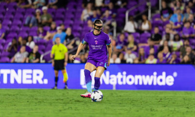 Image of Haley McCutcheon wearing a protective mask on her face playing against San Diego.