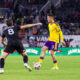 Image of Adrian Marin playing the ball as Jared Stroud of D.C. United defends.
