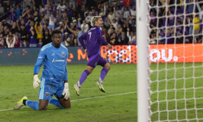 Image of Antoine Griezmann celebrating his goal against D.C. United as Sean Johnson reacts.